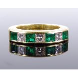 An 18ct gold emerald and diamond half hoop ring, set with 4 Muzo mine Colombian emeralds and 3