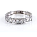 A graduated diamond half eternity ring, engraved platinum settings, total diamond content approx