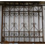 A large wrought-iron and scrolled gate, W122cm, H200cm