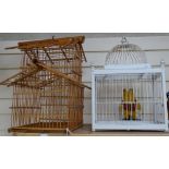 A bamboo bird cage, and another