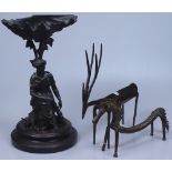 A cast-iron comport supported by a figure, 12.75", an African antelope and stylised horse