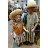 2 Vintage plaster shop mannequins in contemporary clothing, tallest 50"