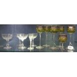 A set of 5 enamelled and gilded goblets, 8", and another, 4 champagne glasses, and a glass with milk