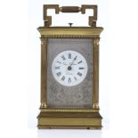 A French brass-cased carriage clock, by Charles Frodsham of London, with fluted columns and striking