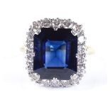 An 18ct gold large synthetic sapphire and diamond cluster ring, sapphire measures 14.2mm x 12.1mm