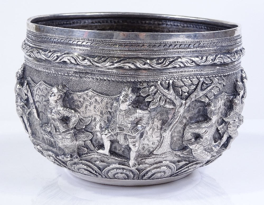 A large Burmese silver Thabeik bowl, with high relief battle scenes and peacock mark on base, - Image 2 of 4