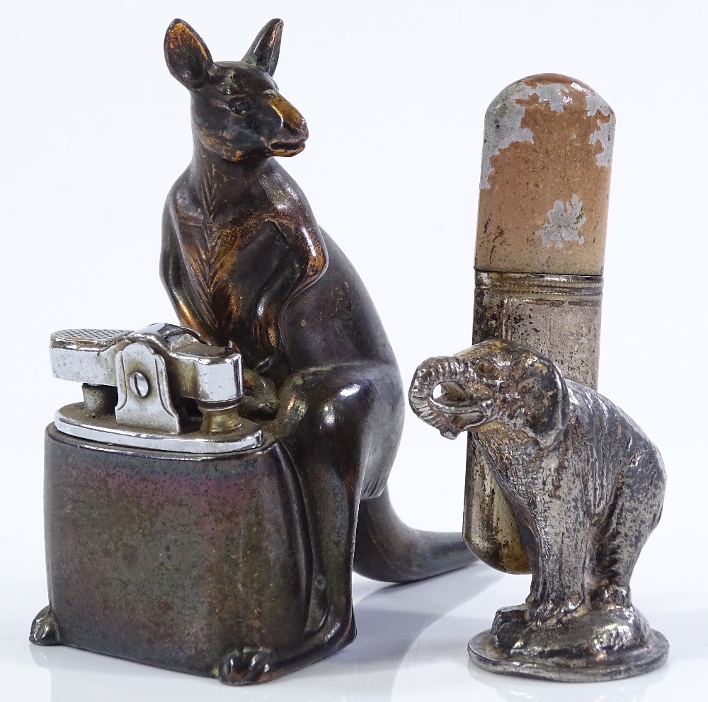 A novelty kangaroo design table lighter, height 9cm, and an electroplate elephant design table