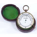 A 19th century pocket barometer, enamel dial in gilt-metal case, with original red leather