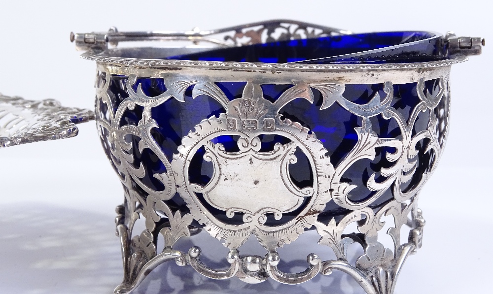 A silver swing-handled basket with blue glass liner, diameter 11cm, together with a silver pierced - Image 3 of 3