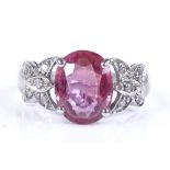 An 18ct white gold ruby and diamond dress ring, ruby height 10mm, size K, 4.3g