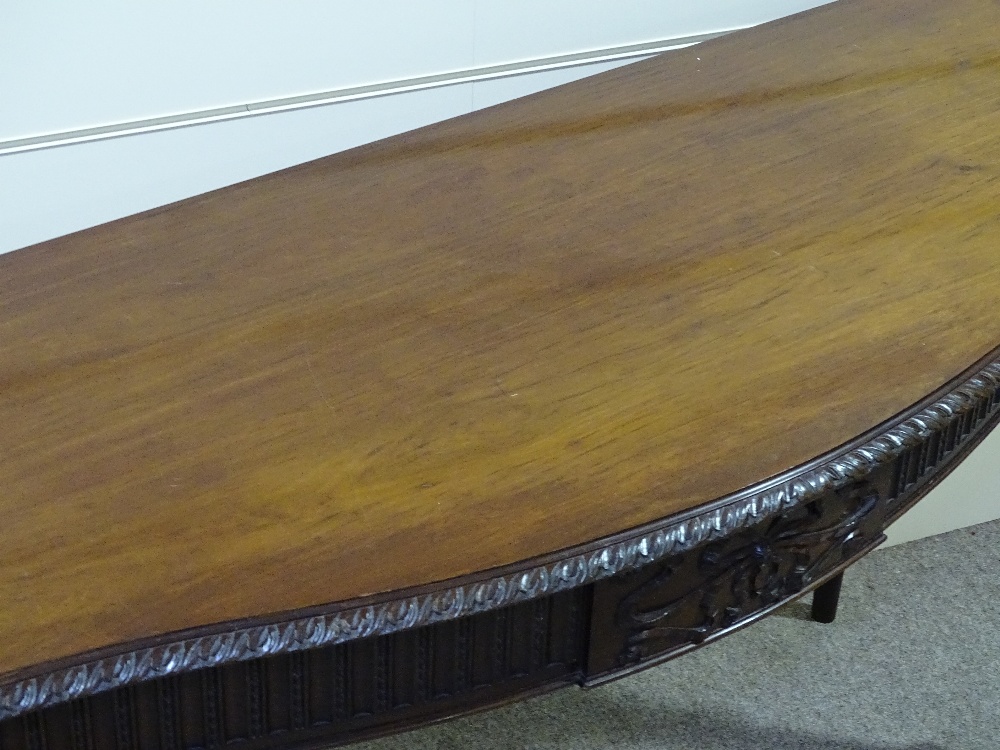An Edwardian mahogany serpentine front serving table, with carved frieze, raised on turned and - Image 2 of 4