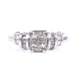 A 14ct white gold diamond cluster ring, with 4 Princess-cut diamonds and tapered baguette shoulders,