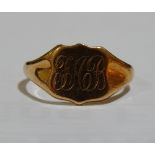 A 9ct rose gold shield-shaped signet ring, maker's marks JW Ltd, panel height 11.3mm, size S, 3.1g