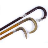 A silver-topped walking stick, hallmarks London 1905, and 2 horn-handled walking sticks (3)