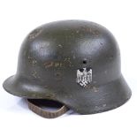 A German Army camouflage helmet with decals
