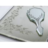 A Victorian wall mirror with etched vine decoration, 46cm x 33cm, and a similar hand mirror (2)