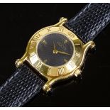 A lady's Gucci 6500L Quartz wristwatch, gold plated case with black dial and Roman numeral bezel,