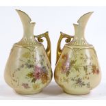 A pair of Royal Worcester ewers with painted floral and gilded decoration, pattern no. 1668,