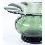 A Whitefriars glass vase circa 1900, by Harry Powell, in dark green colour, height 5.5cm, diameter