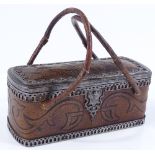 An unusual 19th century French leather-bound sewing box of small size, with embossed decoration