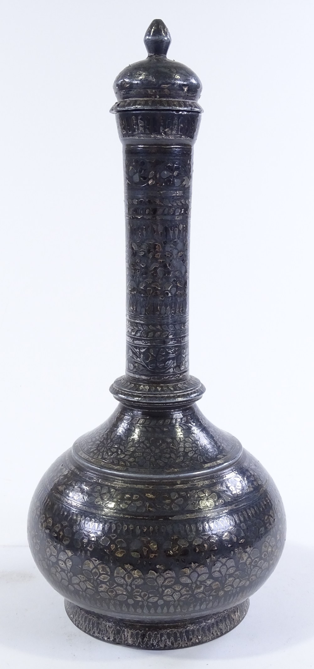 An Oriental silvered metal narrow necked vase and cover, height 34cm