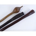 2 Ethnic clubs and a Tribal carved wood axe handle (3)