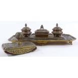 A Continental brass desk stand with inkwells and matching blotter, width 34cm