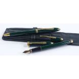 A cased set of 3 Cross green lacquer pens