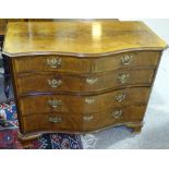 A 19th century mahogany serpentine chest of drawers, with fluted columns and brass escutcheons,