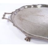 A large silver plated oval tray, with beaded edge and claw and ball feet, length 72cm