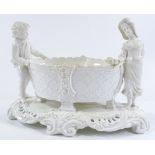 A Victorian Moore Brothers ceramic table centre basket, flanked by 2 children figures, length