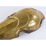 An Islamic engraved brass horse armour face cover, length 58cm