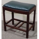 A Victorian mahogany dressing stool with green leather seat