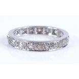 An unmarked white gold diamond set eternity ring, band width 3.3mm, size O, 4.9g