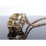 A 9ct gold figural Churchill head pendant necklace, on unmarked 9ct gold Prince of Wales chain,