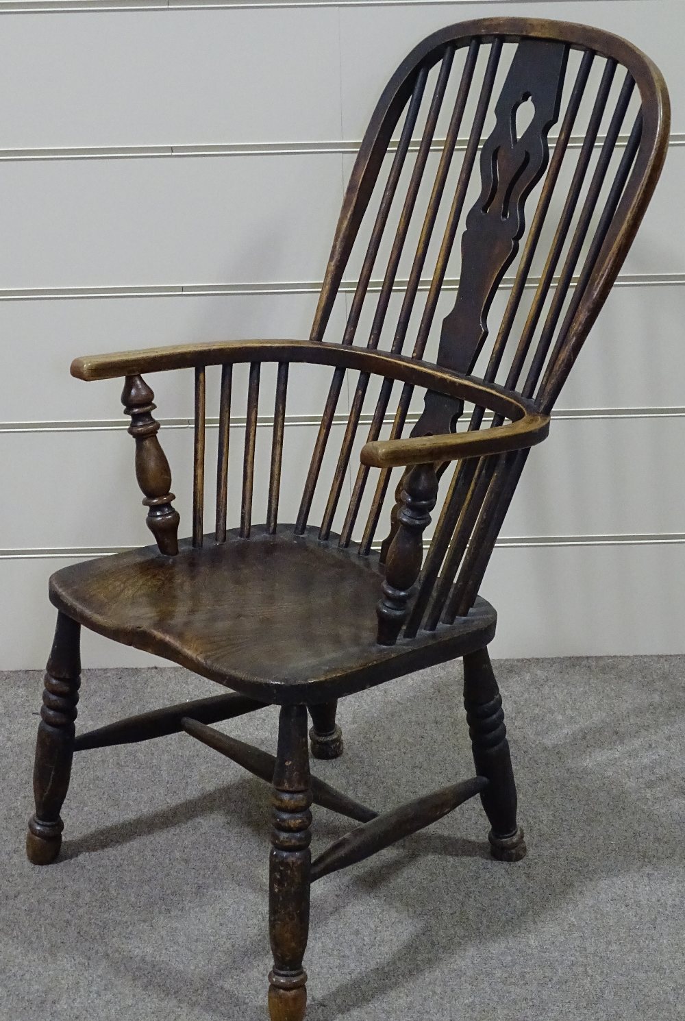 An elm-seated bow-arm Windsor chair