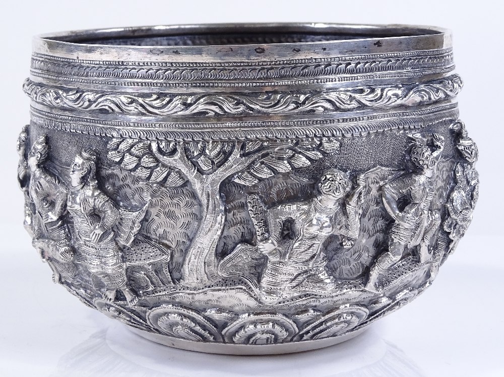 A large Burmese silver Thabeik bowl, with high relief battle scenes and peacock mark on base, - Image 3 of 4