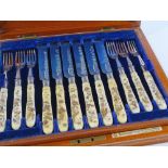A superb quality set of mid-19th century ivory Shibayama-handled dessert knives and forks for 12