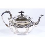An Edwardian oval silver teapot, with acanthus leaf decoration and ivory insulators, height 15cm, by