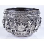 A large Burmese silver Thabeik bowl, with high relief battle scenes and peacock mark on base,