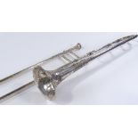 A Victorian silver plated trombone, with engraved decoration and inscription dated 1895