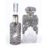 2 silver-mounted glass scent bottles, with relief embossed scroll and pierced lattice work, by Henry