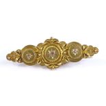 A 15ct gold 3-stone rose diamond brooch, with rope twist surrounds and applied gold flowers,