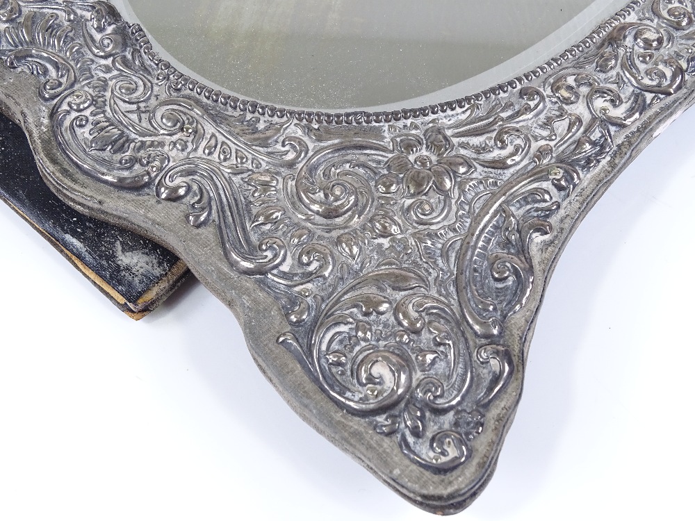 An Edwardian silver-fronted photo frame, with all over relief embossed foliate and scrollwork - Image 3 of 3