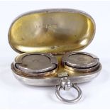 An Edwardian silver sovereign and half sovereign case, of plain oval form, by E J Trevitt & Sons