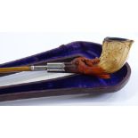 A 19th century silver-mounted carved Meerschaum pipe, length 43cm, in original leather case