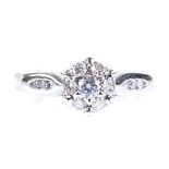 An 18ct white gold diamond cluster flowerhead ring, with channel set diamond shoulders, setting