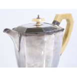An Art Deco silver hot water jug, with fluted rim decoration, and ivory handle and knop, by George
