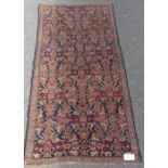 A blue and red ground Azerbaijan rug, with floral border, 6'8" x 3'5"