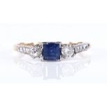 An 18ct gold 3-stone sapphire and diamond ring, with platinum-topped settings, square-cut sapphire